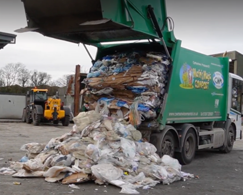 A CWM rubbish lorry unloading it's waste