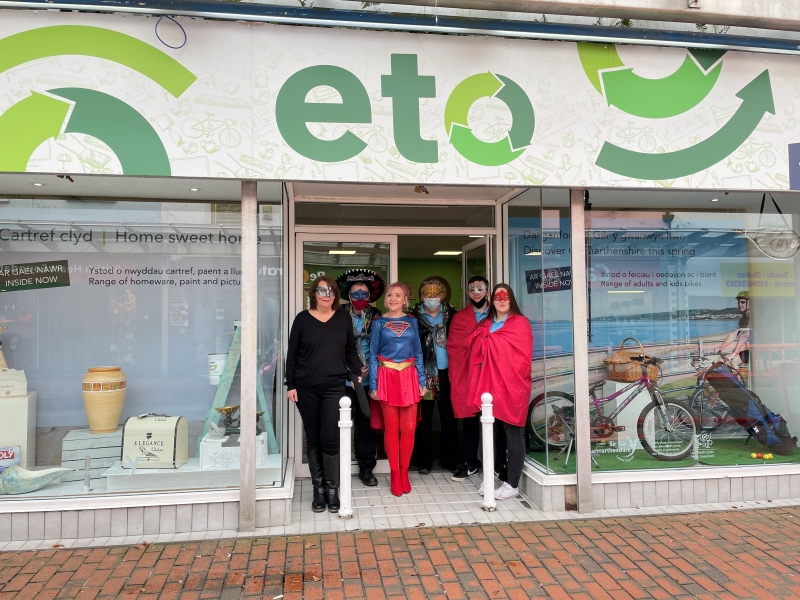 ETO team in fancy dress standing in the doorway of ETO Shop