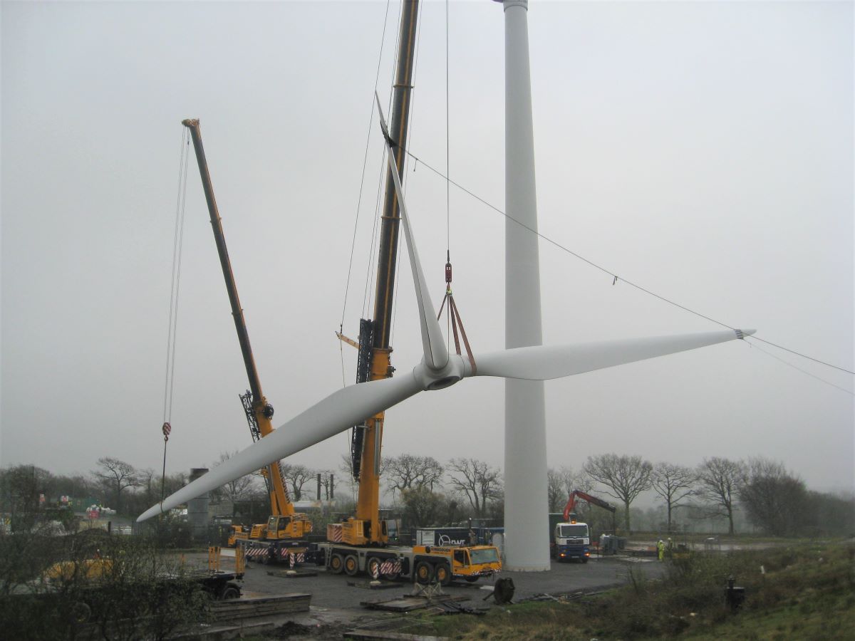 Wind turbine being lifted by a crane